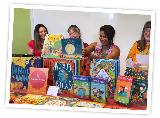 Community Booksellers holding up Barefoot books