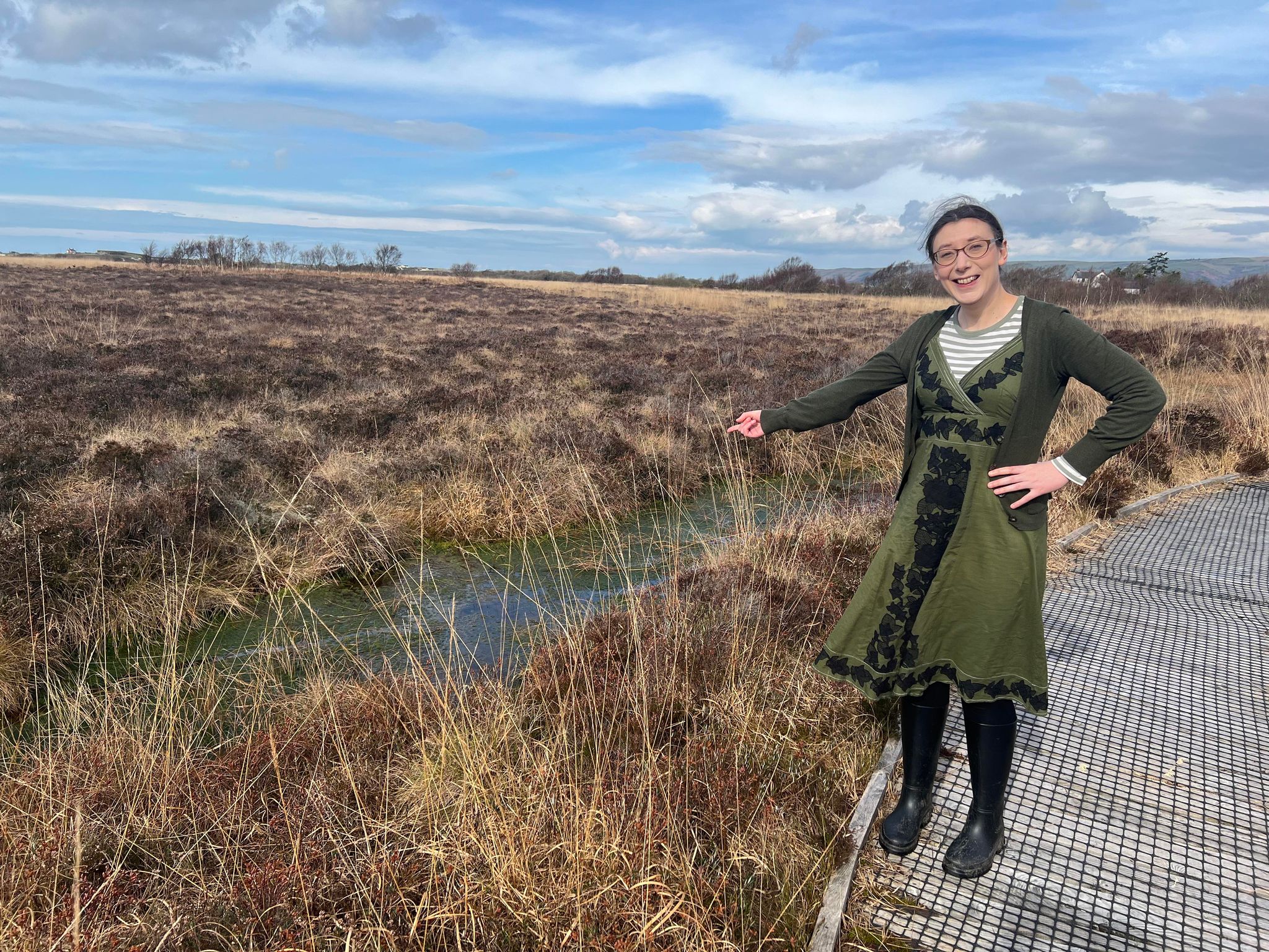 Jessica Law pointing to a bog